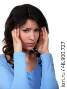 Woman suffering from headache. Стоковое фото, агентство Ingram Publishing / Фотобанк Лори