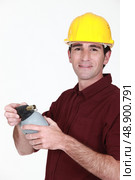 Tradesman holding a blowtorch. Стоковое фото, агентство Ingram Publishing / Фотобанк Лори