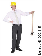 Architect holding pick-axe. Стоковое фото, агентство Ingram Publishing / Фотобанк Лори