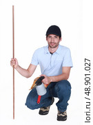 Man with copper pipe and a blowtorch. Стоковое фото, агентство Ingram Publishing / Фотобанк Лори