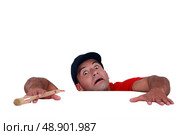 Terror-stricken man holding on for dear life. Стоковое фото, агентство Ingram Publishing / Фотобанк Лори