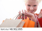 Closeup of a woman with store bags. Стоковое фото, агентство Ingram Publishing / Фотобанк Лори
