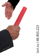 Businessmen passing the baton. Стоковое фото, агентство Ingram Publishing / Фотобанк Лори