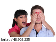 brunette playing trick on fiance. Стоковое фото, агентство Ingram Publishing / Фотобанк Лори