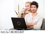 Couple relaxing at home on a Sunday morning. Стоковое фото, агентство Ingram Publishing / Фотобанк Лори