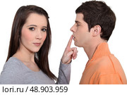Woman with finger touching man’s lips. Стоковое фото, агентство Ingram Publishing / Фотобанк Лори