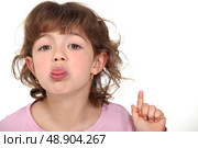 little girl sticking her tongue out. Стоковое фото, агентство Ingram Publishing / Фотобанк Лори