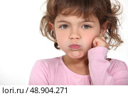 Little girl blowing her cheeks. Стоковое фото, агентство Ingram Publishing / Фотобанк Лори