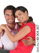 Boyfriend carrying girlfriend. Стоковое фото, агентство Ingram Publishing / Фотобанк Лори