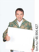 man holding a white board. Стоковое фото, агентство Ingram Publishing / Фотобанк Лори
