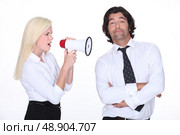 girl with loudspeaker and man. Стоковое фото, агентство Ingram Publishing / Фотобанк Лори