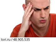 Man grimacing, white background. Стоковое фото, агентство Ingram Publishing / Фотобанк Лори
