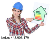 Laborer with energy efficiency chart. Стоковое фото, агентство Ingram Publishing / Фотобанк Лори