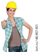 Tradeswoman with a can-do attitude. Стоковое фото, агентство Ingram Publishing / Фотобанк Лори