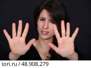 woman making a stop sign gesture with her hands. Стоковое фото, агентство Ingram Publishing / Фотобанк Лори
