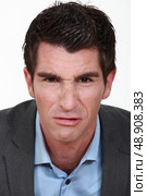 Grimacing businessman. Стоковое фото, агентство Ingram Publishing / Фотобанк Лори