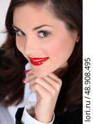 Seductive brunette with bright red lipstick. Стоковое фото, агентство Ingram Publishing / Фотобанк Лори