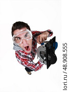 An impatient man using a circular saw. Стоковое фото, агентство Ingram Publishing / Фотобанк Лори