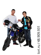 Men with motorbike and gold cup. Стоковое фото, агентство Ingram Publishing / Фотобанк Лори