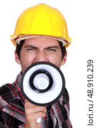 A construction worker calling a strike. Стоковое фото, агентство Ingram Publishing / Фотобанк Лори