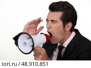 Businessman with a loudhailer. Стоковое фото, агентство Ingram Publishing / Фотобанк Лори