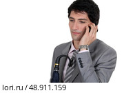 Weary businessman talking on his mobile phone. Стоковое фото, агентство Ingram Publishing / Фотобанк Лори