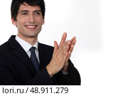 A businessman clapping hands. Стоковое фото, агентство Ingram Publishing / Фотобанк Лори