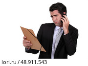A dubious businessman over the phone. Стоковое фото, агентство Ingram Publishing / Фотобанк Лори