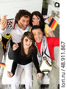 German football fans at home. Стоковое фото, агентство Ingram Publishing / Фотобанк Лори