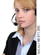 Bitter woman wearing a headset. Стоковое фото, агентство Ingram Publishing / Фотобанк Лори