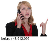 Angry blond businesswoman. Стоковое фото, агентство Ingram Publishing / Фотобанк Лори