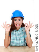 Woman with helmet looks disgusted. Стоковое фото, агентство Ingram Publishing / Фотобанк Лори