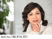 Woman wearing a high-necked sweater. Стоковое фото, агентство Ingram Publishing / Фотобанк Лори