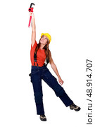 Female plumber holding wrench. Стоковое фото, агентство Ingram Publishing / Фотобанк Лори
