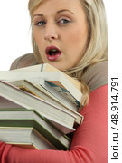 Young woman overworked with a stack of books. Стоковое фото, агентство Ingram Publishing / Фотобанк Лори