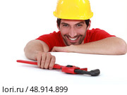 Laughing worker with a wrench. Стоковое фото, агентство Ingram Publishing / Фотобанк Лори