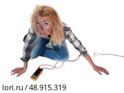 Careless female electrician. Стоковое фото, агентство Ingram Publishing / Фотобанк Лори
