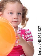 Little girl holding a balloon. Стоковое фото, агентство Ingram Publishing / Фотобанк Лори