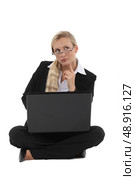 Inspired businesswoman in lotus position. Стоковое фото, агентство Ingram Publishing / Фотобанк Лори