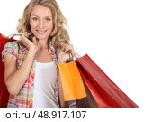 Woman with numerous shopping bags. Стоковое фото, агентство Ingram Publishing / Фотобанк Лори
