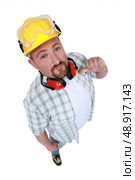 Construction worker indicating himself. Стоковое фото, агентство Ingram Publishing / Фотобанк Лори