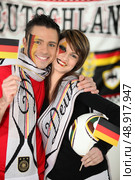 Couple supporting Germany team. Стоковое фото, агентство Ingram Publishing / Фотобанк Лори
