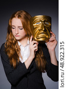 Woman with mask in hypocrisy concept. Стоковое фото, агентство Ingram Publishing / Фотобанк Лори