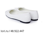 Golden ballet shoes isolated on white. Стоковое фото, агентство Ingram Publishing / Фотобанк Лори