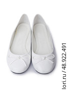 Golden ballet shoes isolated on white. Стоковое фото, агентство Ingram Publishing / Фотобанк Лори
