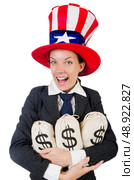 Businesswoman with sacks of money on white. Стоковое фото, агентство Ingram Publishing / Фотобанк Лори