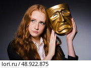 Woman with mask in hypocrisy concept. Стоковое фото, агентство Ingram Publishing / Фотобанк Лори