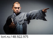 Young priest isolated on the white. Стоковое фото, агентство Ingram Publishing / Фотобанк Лори