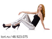 Young redhead girl in tight leggings. Стоковое фото, агентство Ingram Publishing / Фотобанк Лори