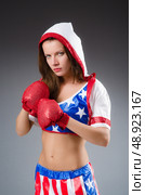 Woman boxer in uniform with US symbols. Стоковое фото, агентство Ingram Publishing / Фотобанк Лори